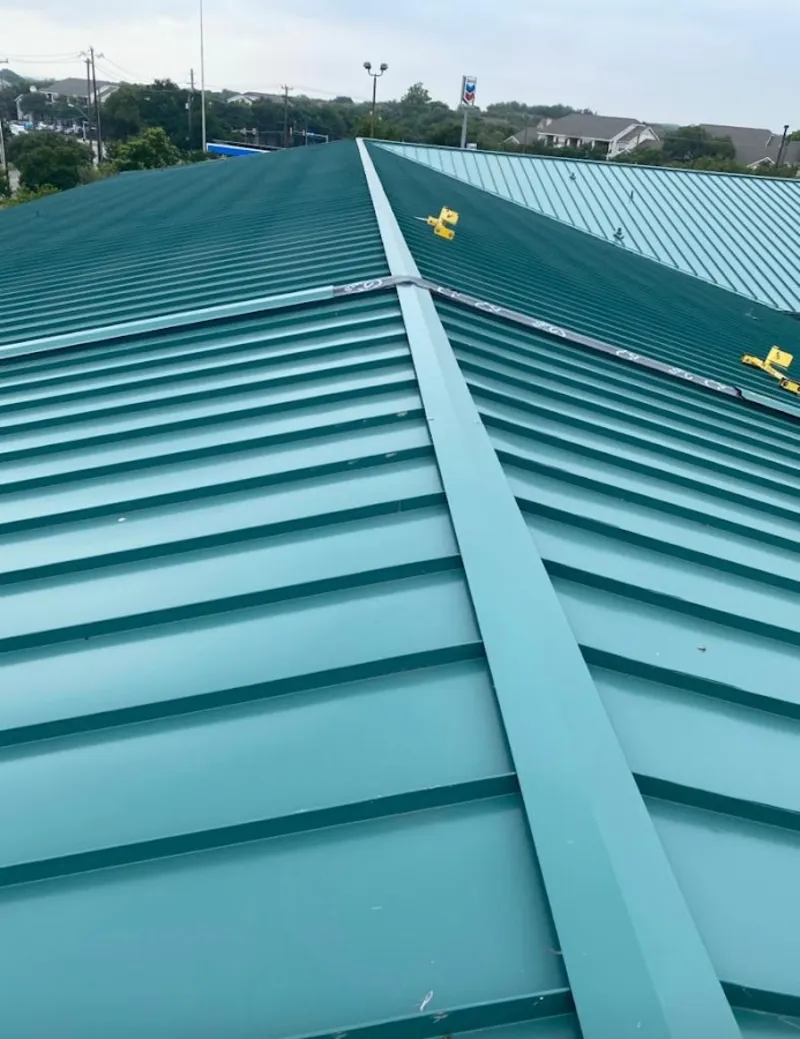 Green commercial metal roof ridge and valley for Metal Roof Repair in Kings Point